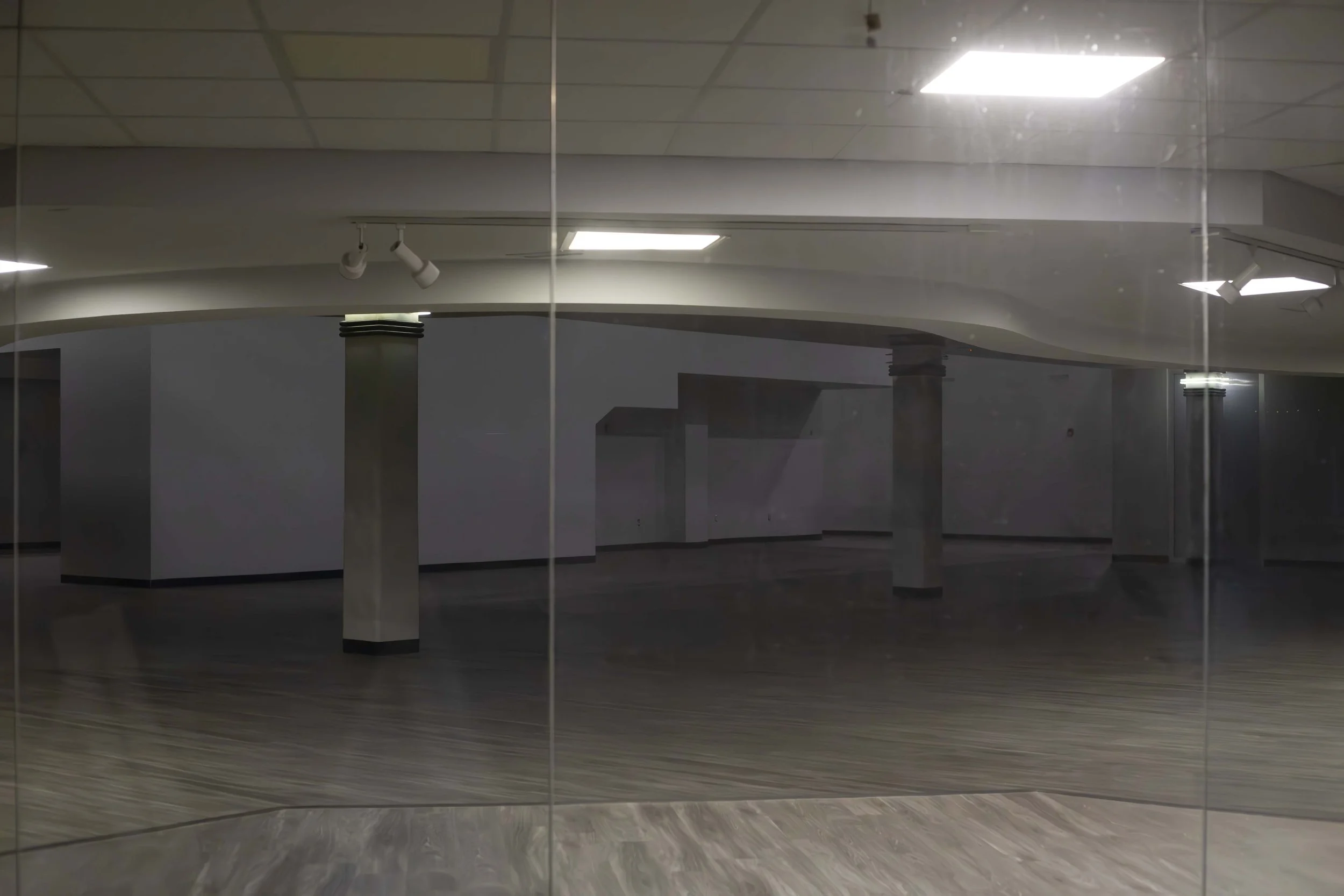  Liminal Spaces are the subject of an internet aesthetic portraying empty or abandoned spaces that appear eerie, forlorn, and often surreal. Liminal Spaces are commonly places of transition or nostalgic appeal. 