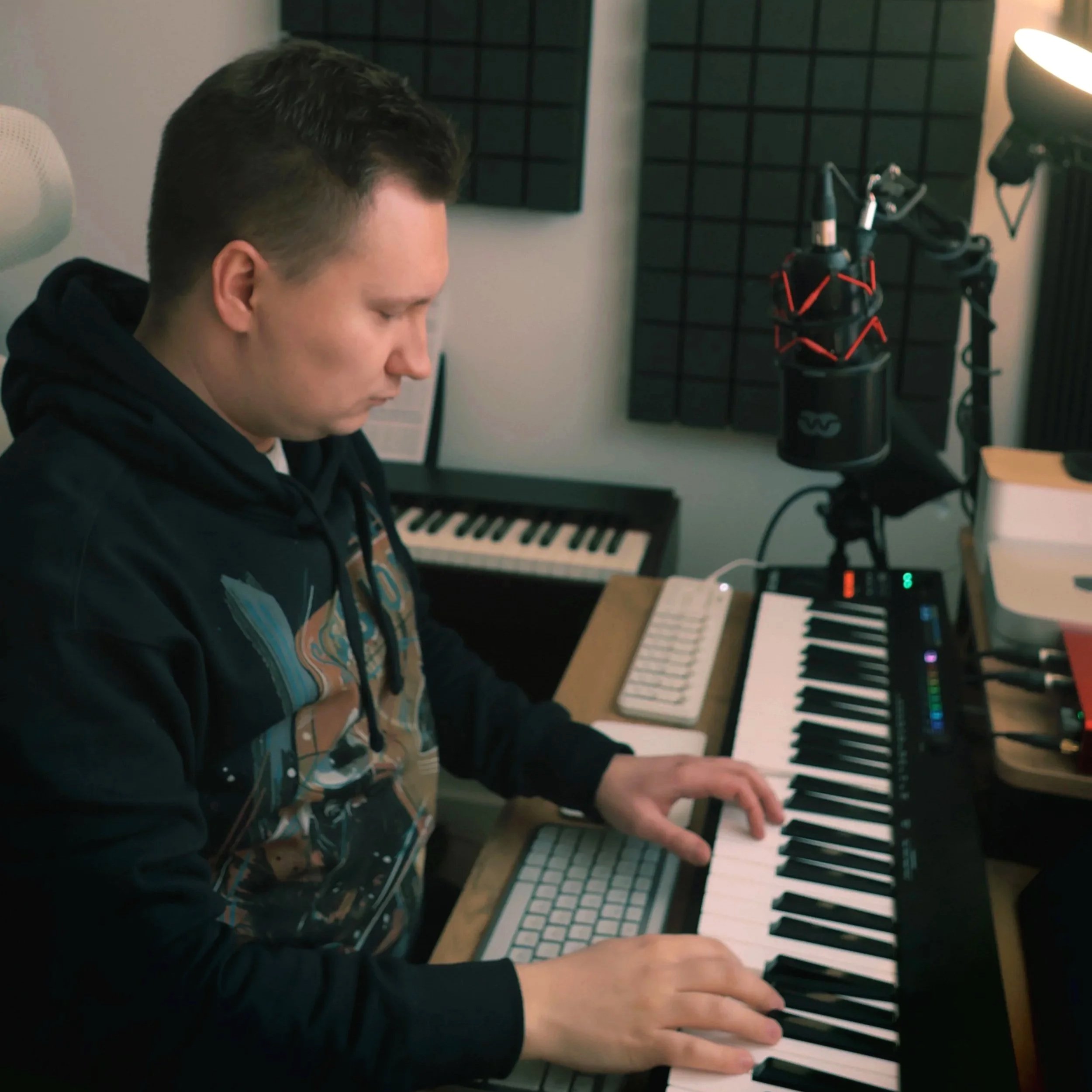 Grzegorz Drozdowski is focusing on composing music by playing on his MIDI Keyboard in his home music studio