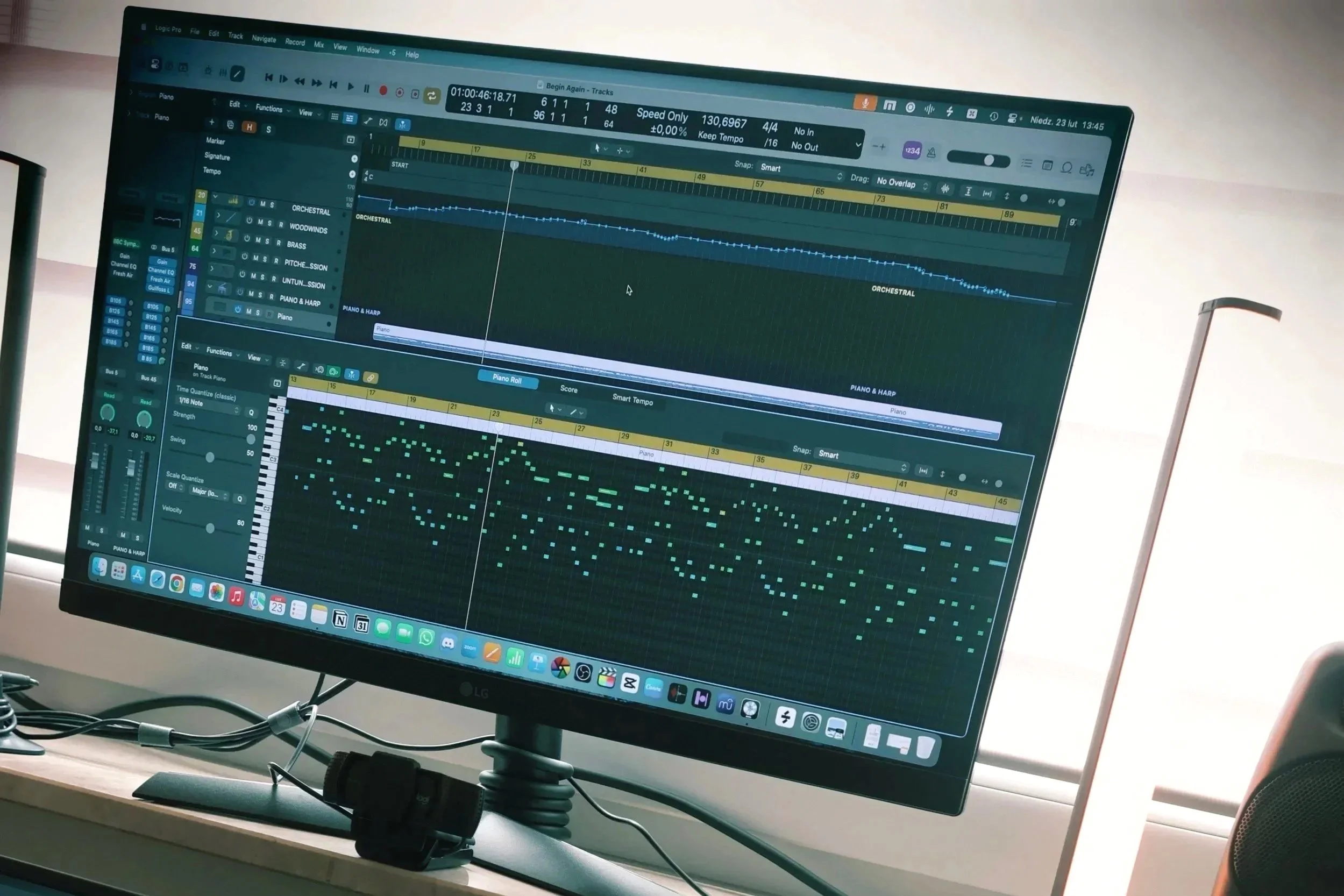 The photo shows Grzegorz Drozdowski's home studio's monitor screen with open Logic Pro session of a video game music track during composing progress