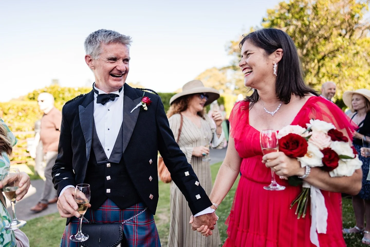 A beautiful Scottish inspired wedding, with a bagpiper leading the bride and groom and all their guest&rsquo;s up to Auckland&rsquo;s stunning Pah Homestead. Michelle wore a radiant red wedding dress while Cameron and his merry men all wore kilts. It