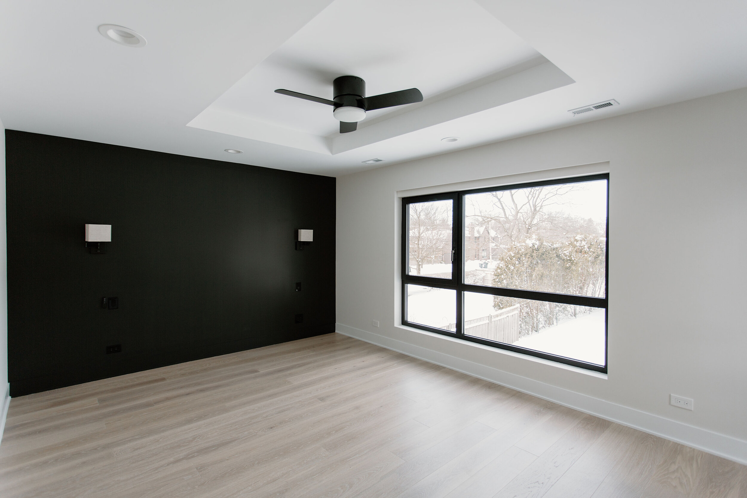 Primary bedroom overlooking the back yard.