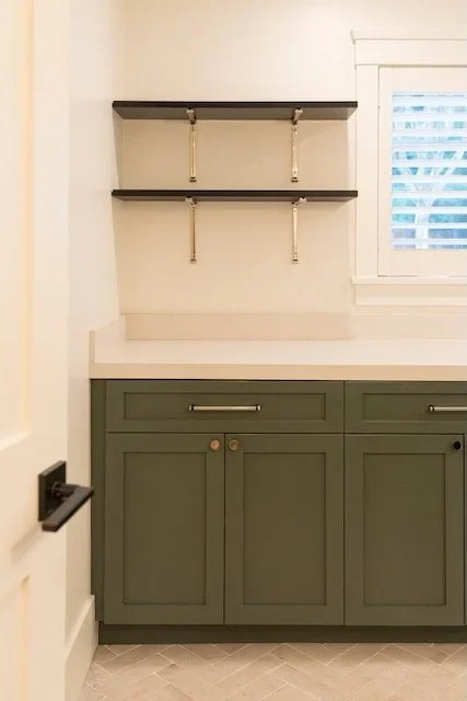Custom cabinetry with integrated open shelving and storage
