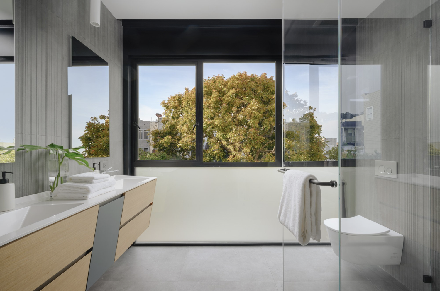 Custom bathroom remodel with vanity, shower, and coordinated finishes
