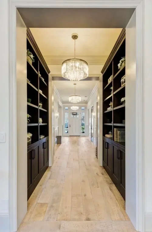 Custom library cabinetry with built-in shelving and storage