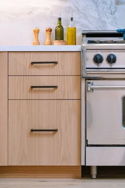Close-up of custom kitchen cabinet construction and finished millwork details