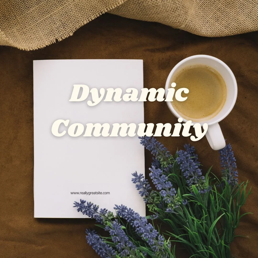 Open notebook next to a cup of coffee and lavender flowers on a brown surface with text "Dynamic Community" overlay.