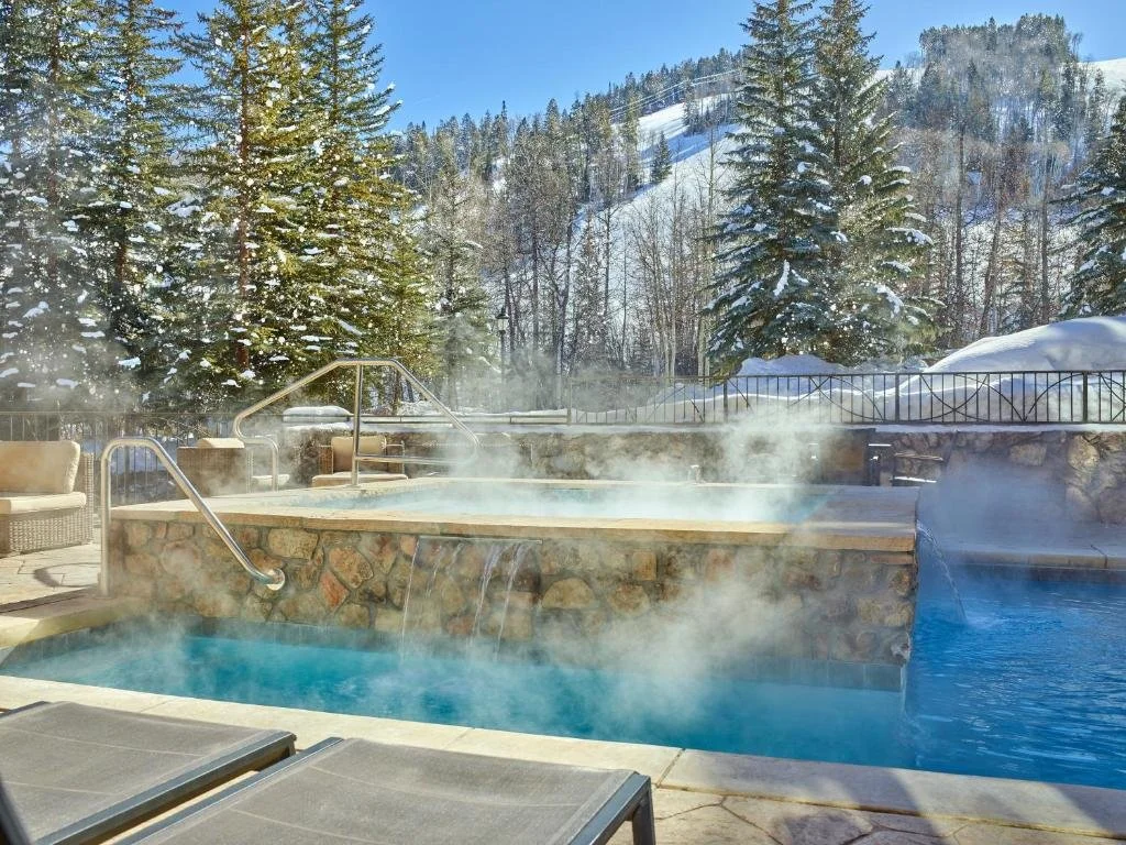pool and hot tubs in winter at the osprey at beaver creek in colorado