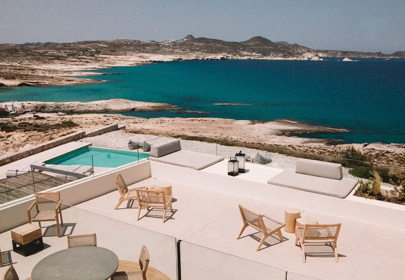 domes white coast milos pool overlooking the aegean in milos greece