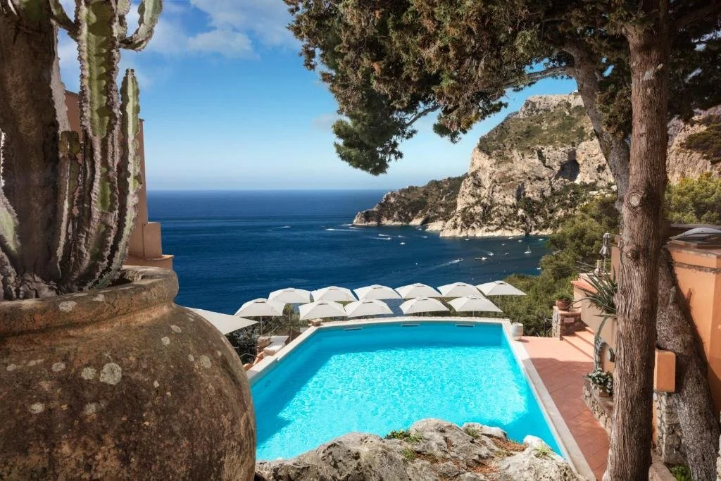 view of pool and bay of capri at punta tragara