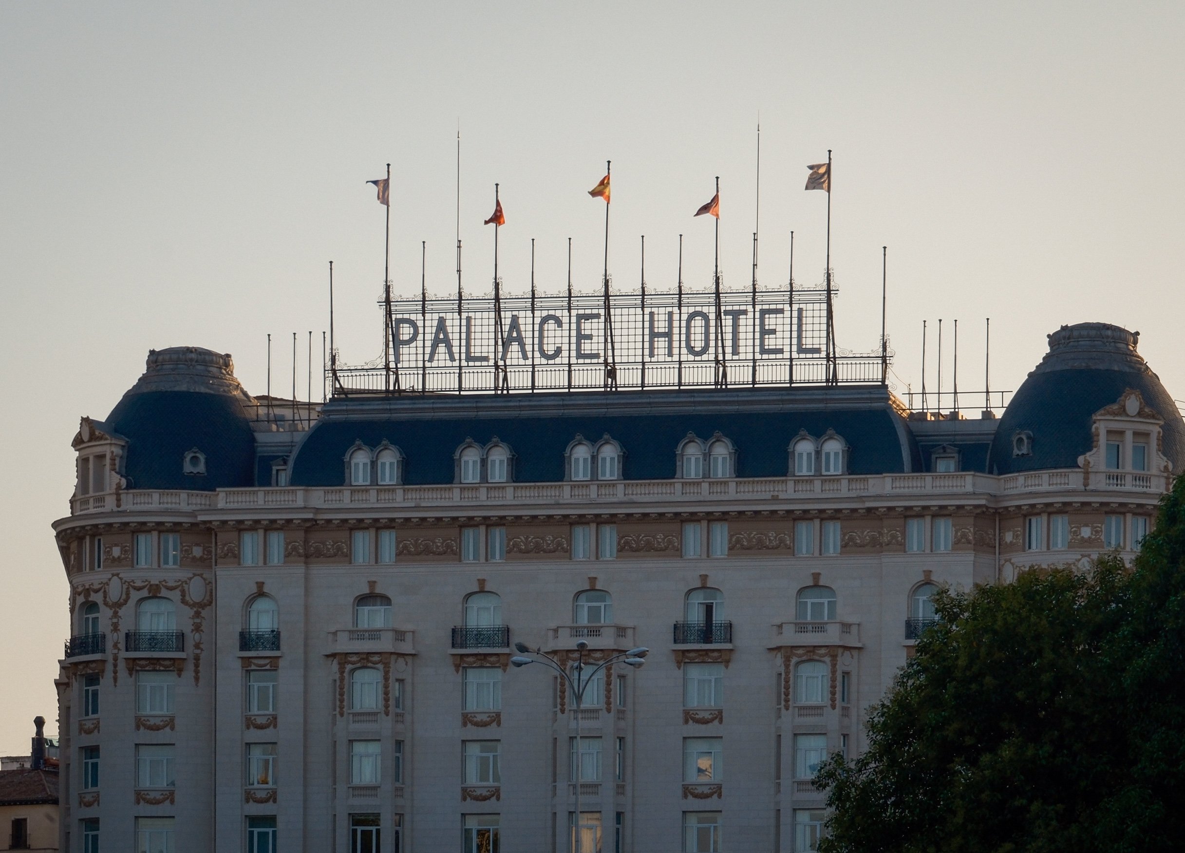 palace hotel and sunset in madrid spain