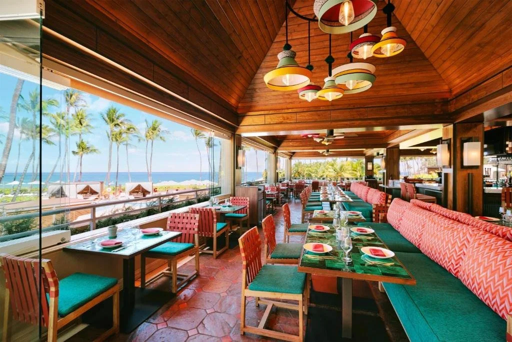 dining area overlooking the sea at grand wailea, a waldorf astoria resort in maui hawaii
