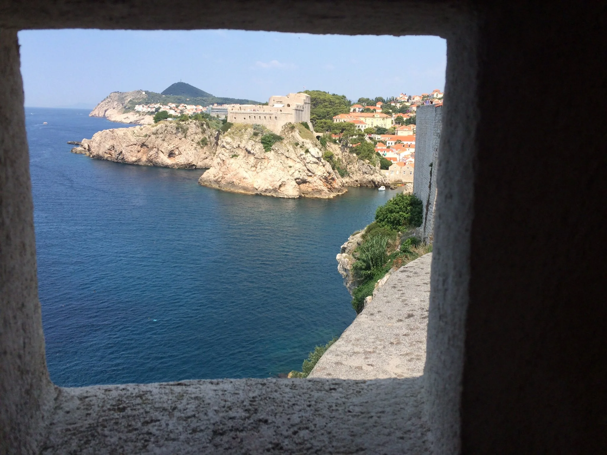looking through turret in walls of old town dubrovnik in croatia