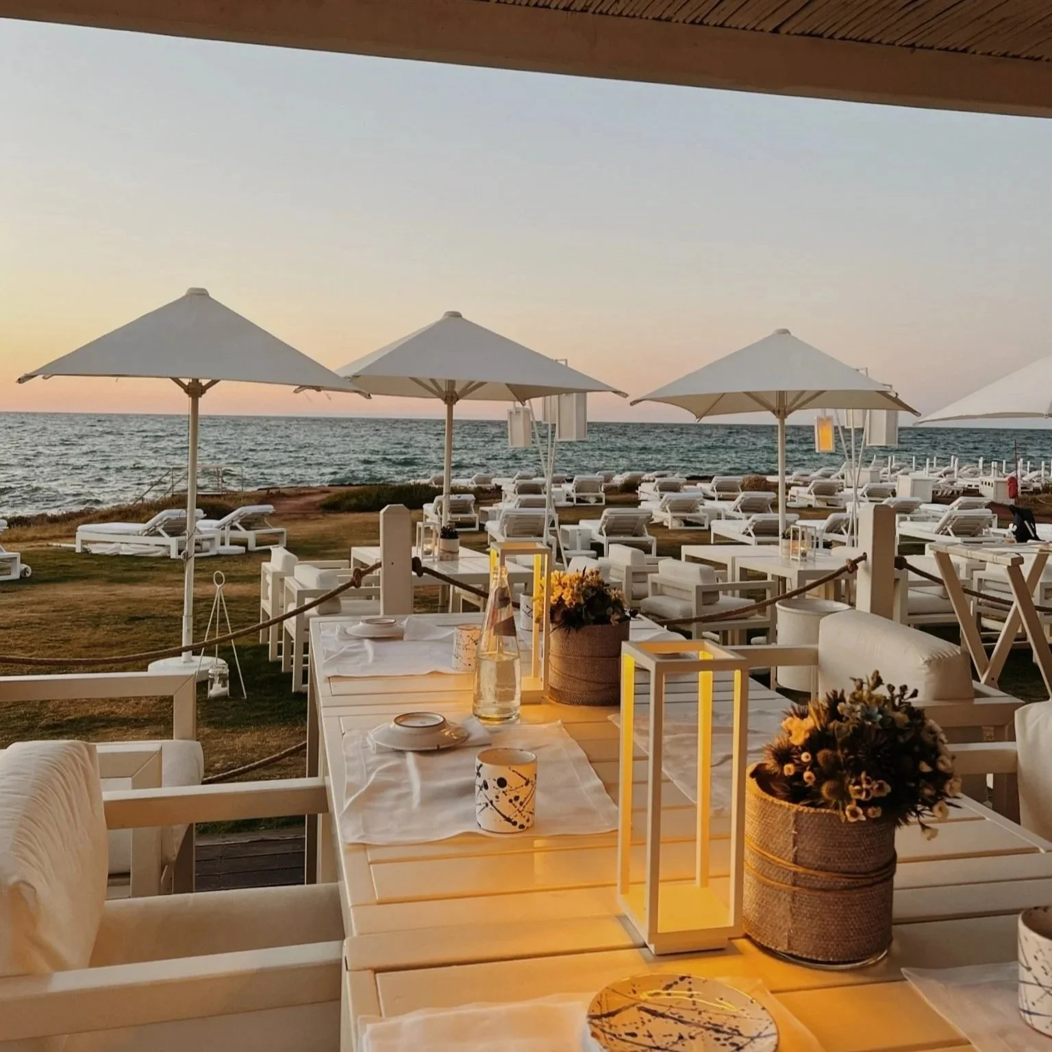 Cala Masciola seaside dining at dusk in Puglia Italy Borgo Egnazia