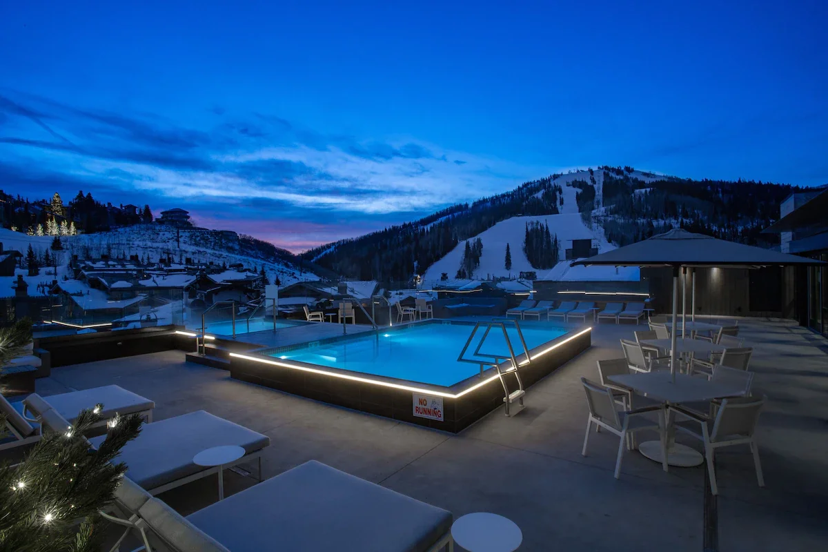 pool at dusk in goldener hirsch park city, utah