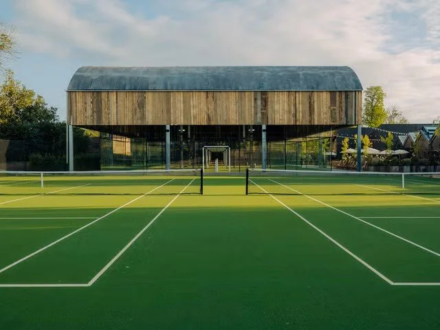 soho farmhouse tennis courts in the cotswolds england