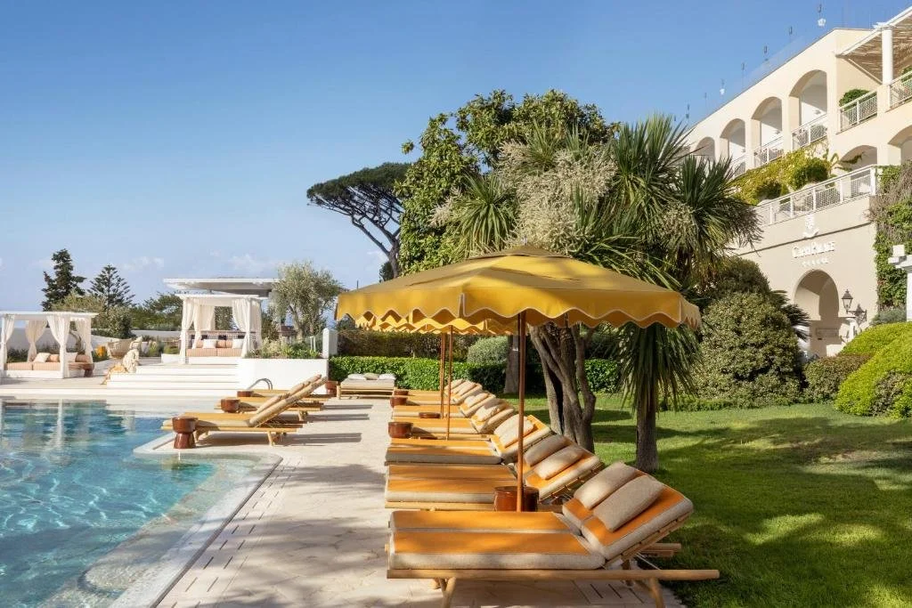 pool and umbrellas as capri palace jumeirah