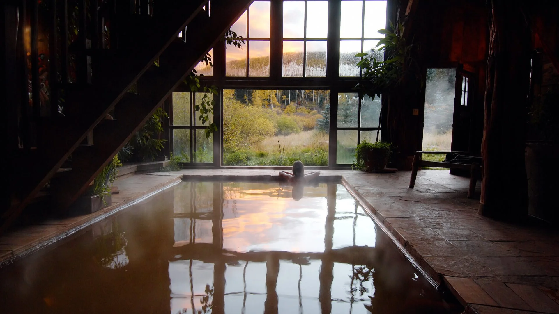 bathhouse at dunton hot springs overlooking yellow aspen leaves