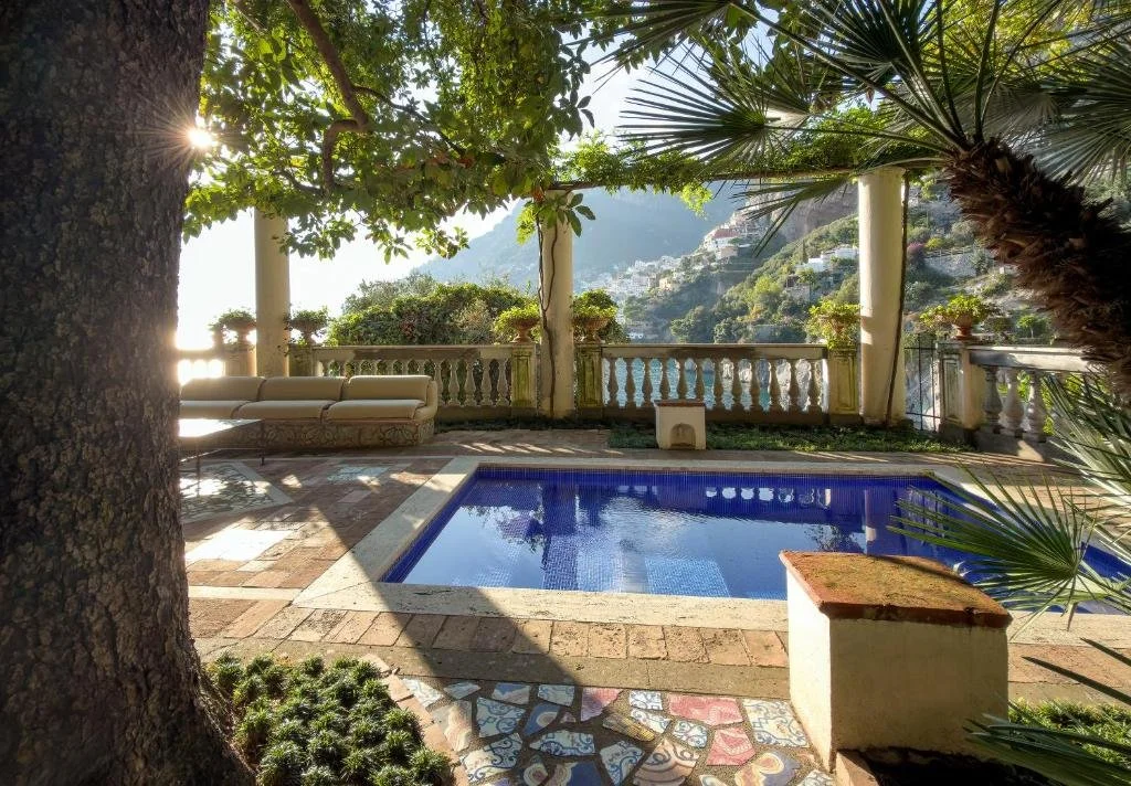 balcony with pool overlooking positano italy at villa treville