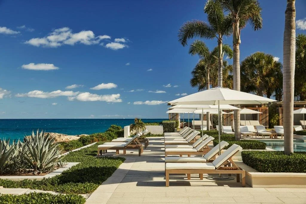loungers overlooking the sea at four seasons resort and residences anguilla