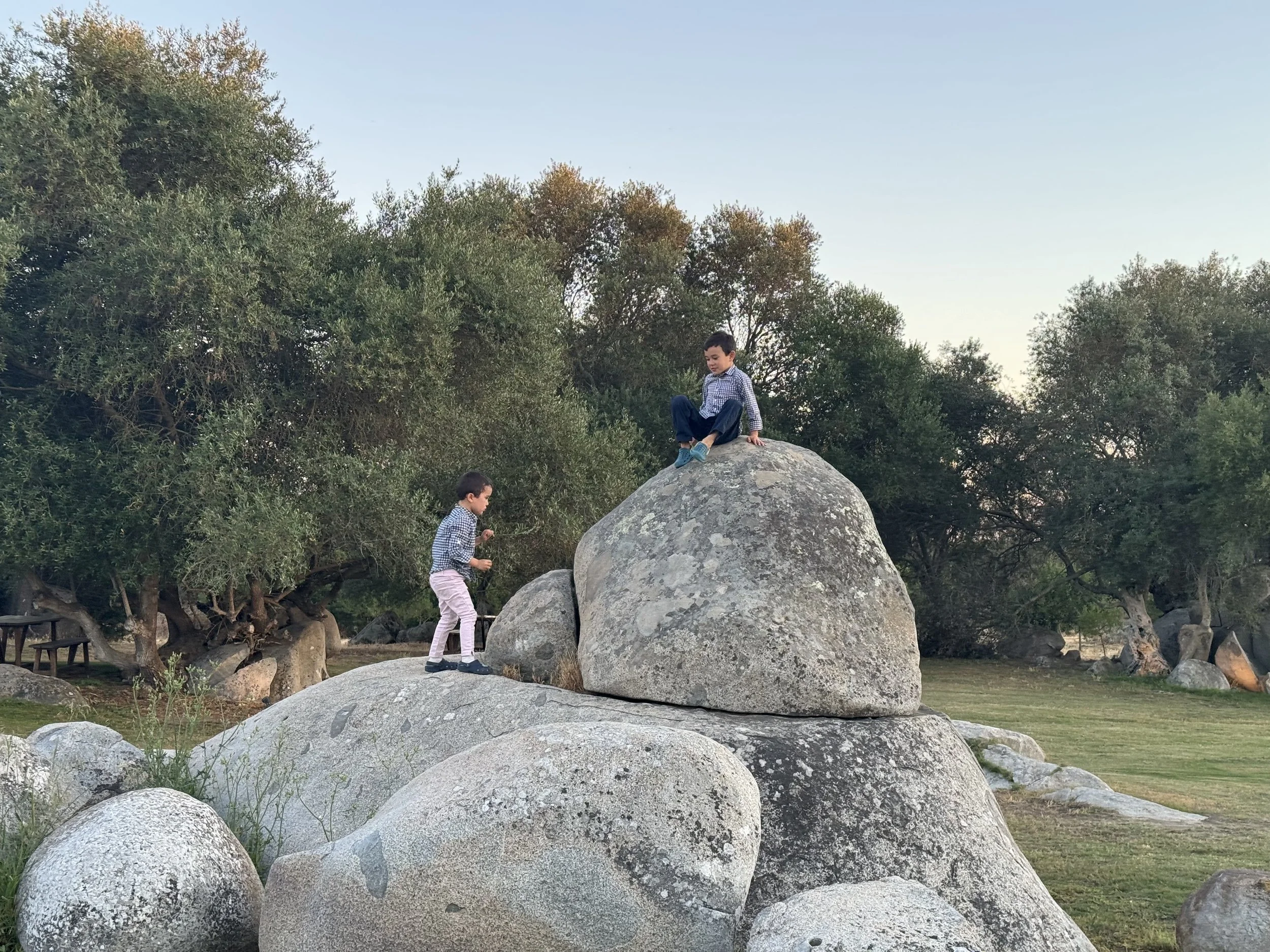 kids playing on rocks at sao lourenco do barrocal in portugal