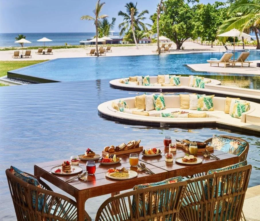 pools overlooking beach at waldorf astoria seychelles platte island