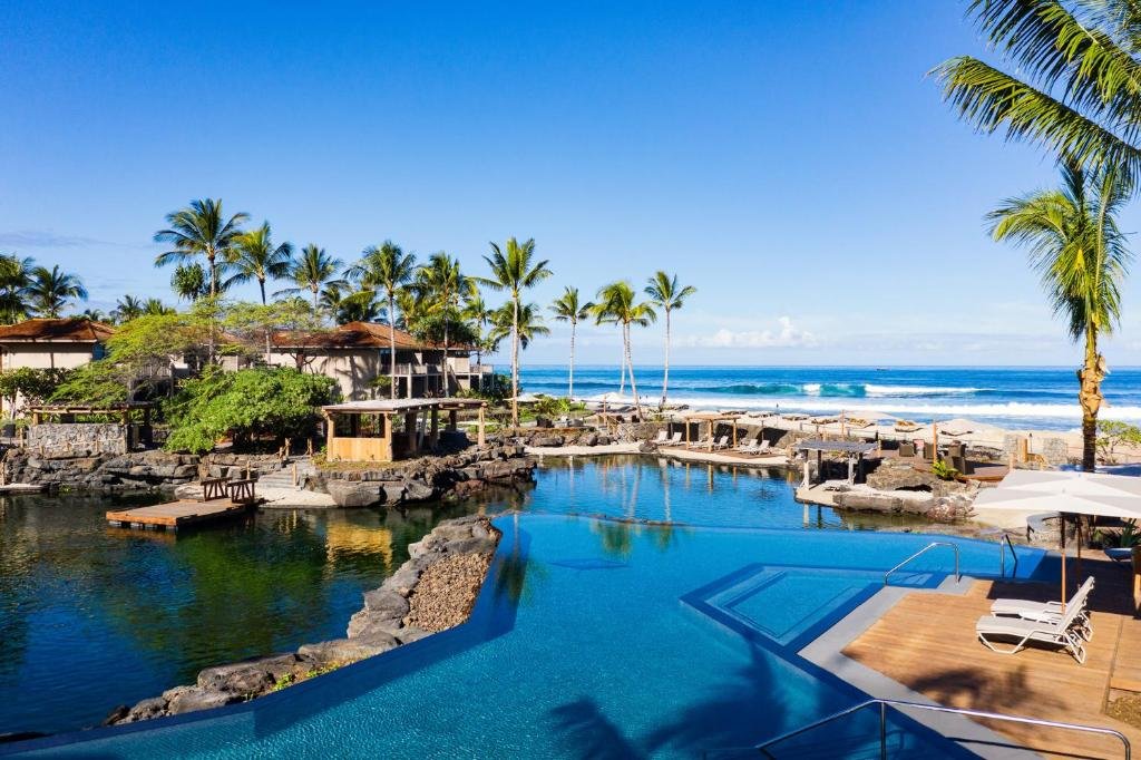 pool and lagoon overlooking the ocean and four seasons resort hualalai
