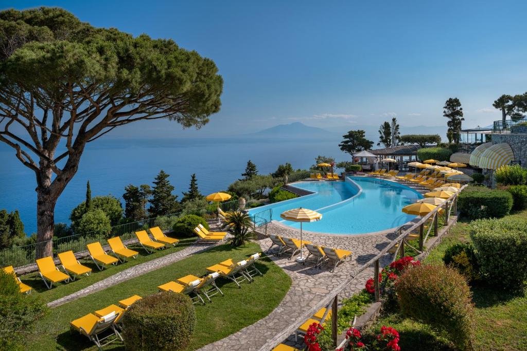 yellow sunloungers near pool at hotel caesar augustus in capri italy