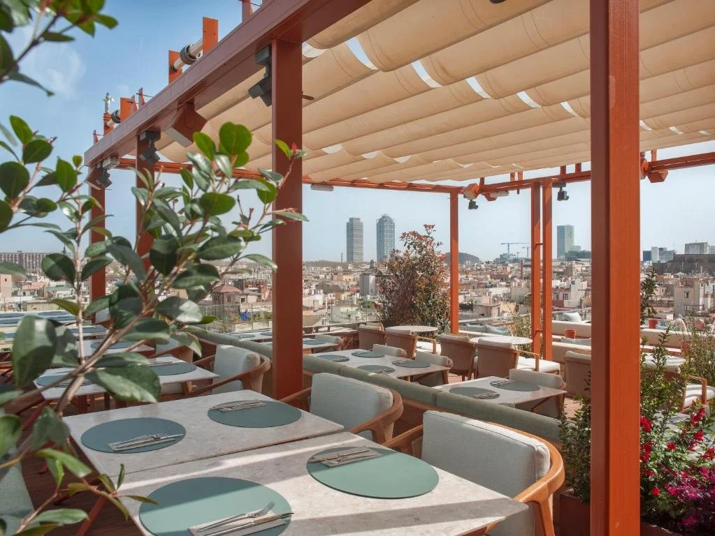 rooftop dining area at grand hotel central in barcelona spain