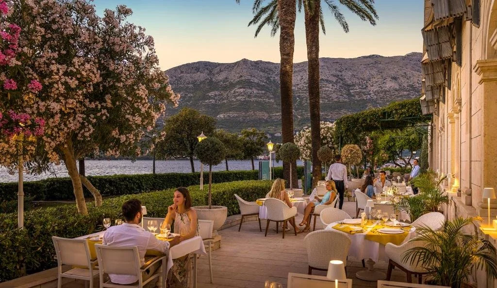 dining area overlooking the sea in korcula town at aminess korcula heritage hotel