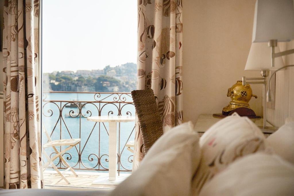 room overlooking the port at welcome hotel in villefrance-sur-mer