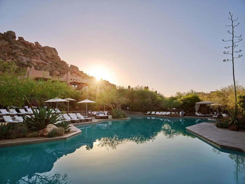 Pool at sunset at four seasons resort scottsdale at troon north in arizona