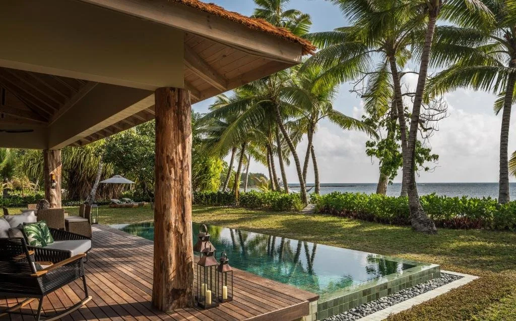 pool overlooking the ocean at four seasons resort seychelles at desroches island in africa