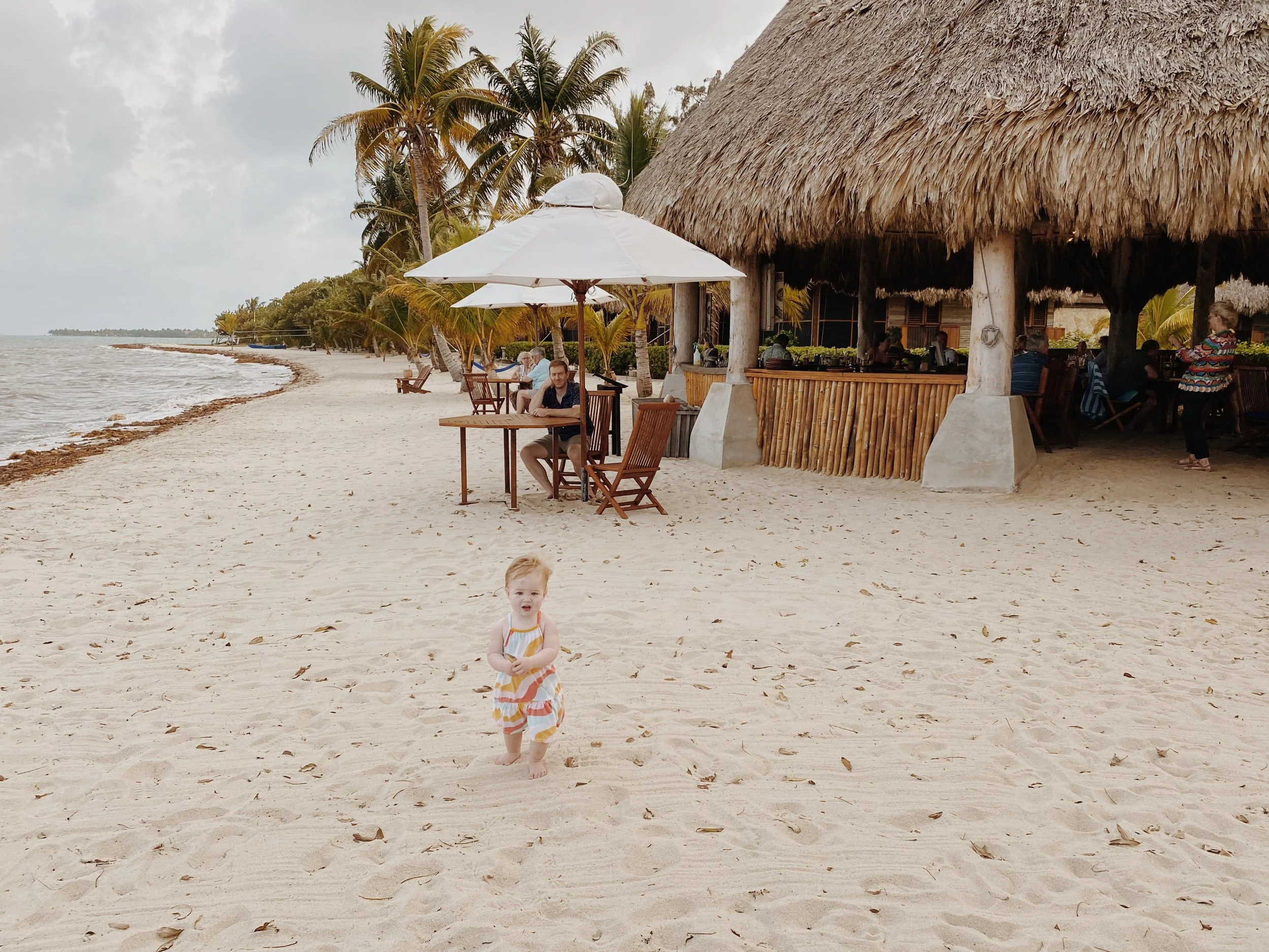 beach and dining area at Turtle Inn in Placencia Belize