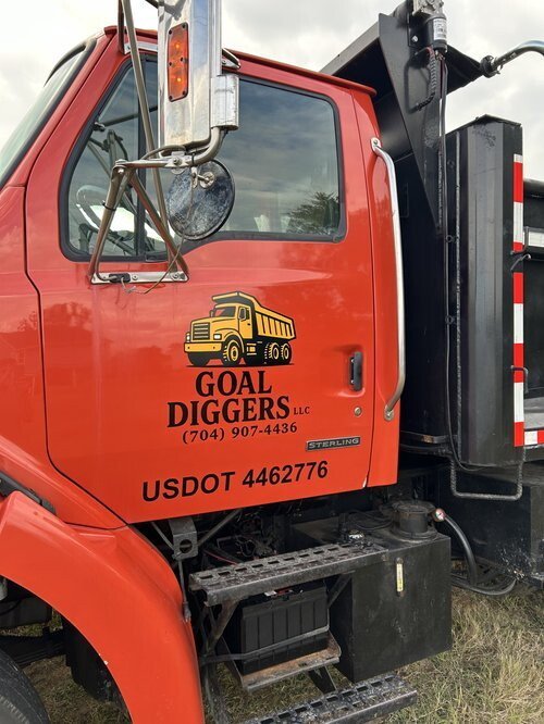 Goal Diggers logo installed on Dump Truck on-site in Charlotte, NC