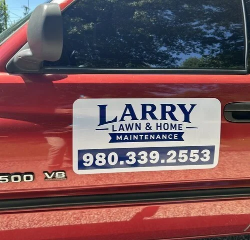 Custom vehicle magnet for Larry Lawn & Home Maintenance installed on work truck in Charlotte NC by Mobile Sign Shop 704.