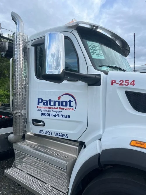Patriot Environmental Services truck lettering and vehicle graphics installed on commercial fleet truck in Concord NC by Mobile Sign Shop 704.