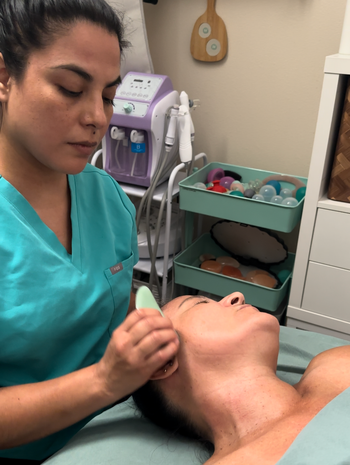 Gua Sha facial massage for lifting and jaw tension.