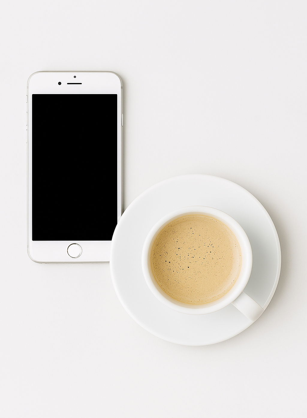 Phone sitting next to coffee cup