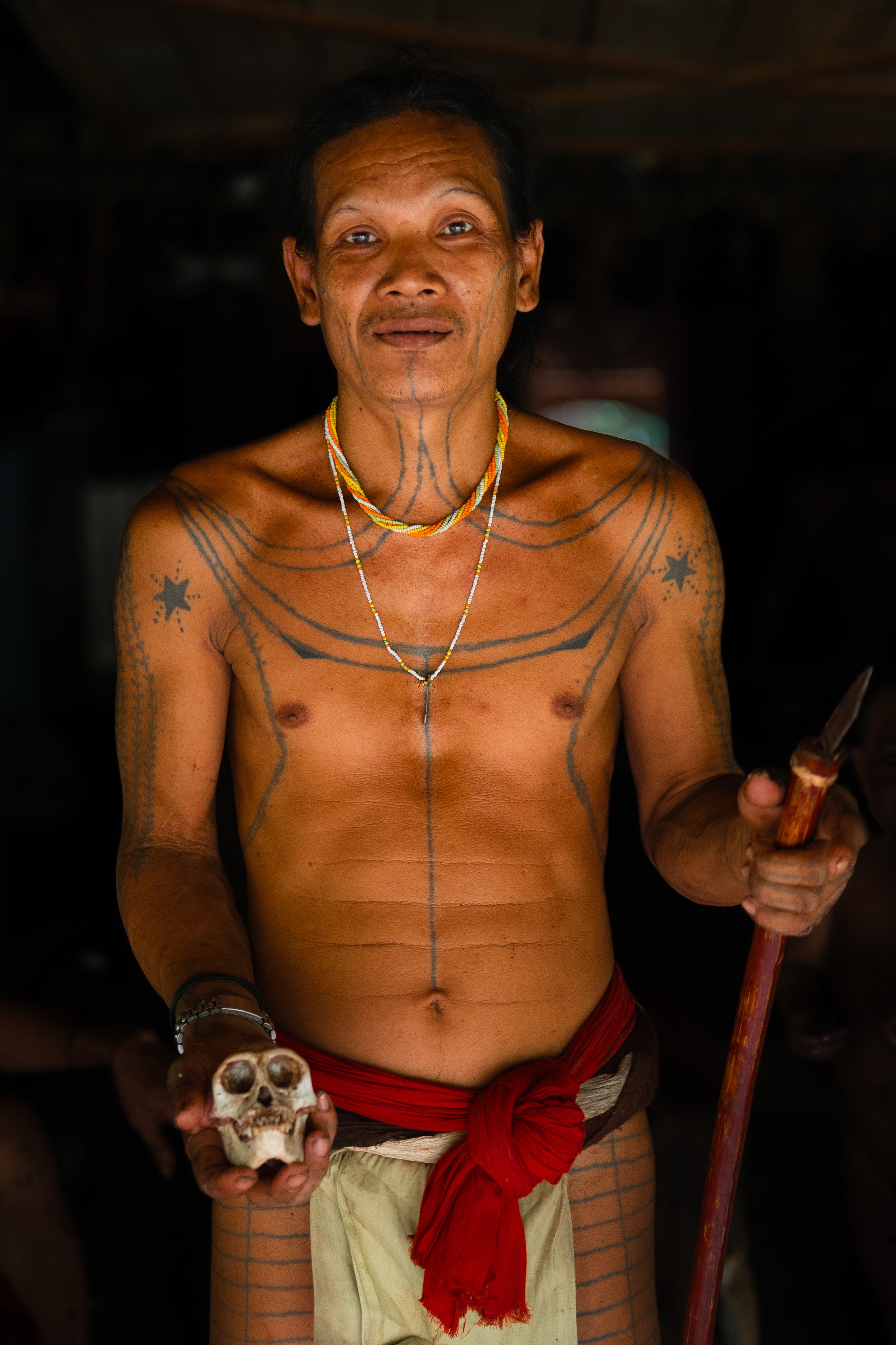 This is Aman Ja with the skull of a gibbon that he killed earlier that day. I actually got to try monkey