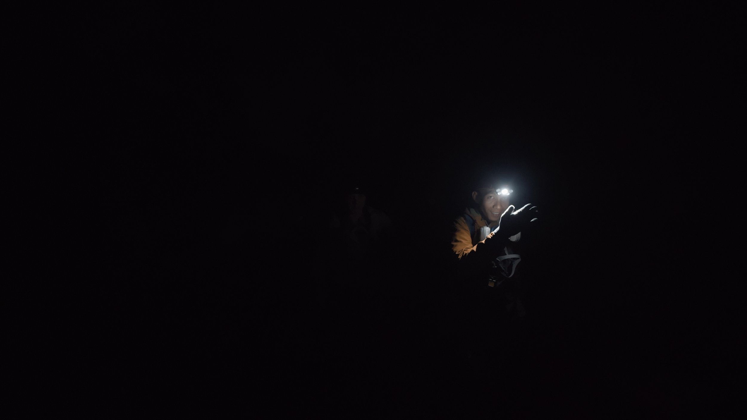 In pitch darkness, we hiked 4km uphill to the top of Ijen