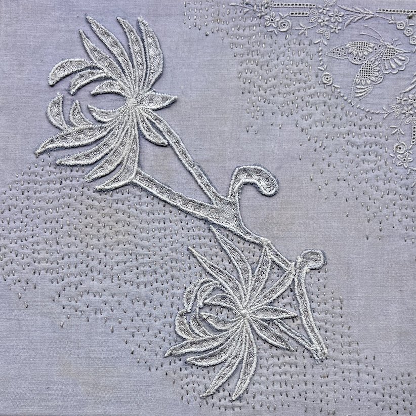 Quiet Reach 2026 
Hand-dyed silk lace fragments from a vintage lace collar appliquéd on hand-dyed vintage handkerchief with hand stitching.
A flowing lace motif moves across the surface, suggesting movement and quiet reach. Repaired vintage handkerch