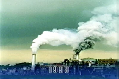 Atsugi incinerator emitting opaque white and gray smoke in 1998.