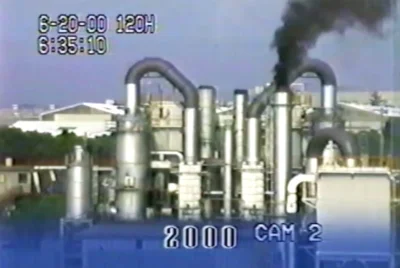 Atsugi incinerator emitting dark smoke in 2000..