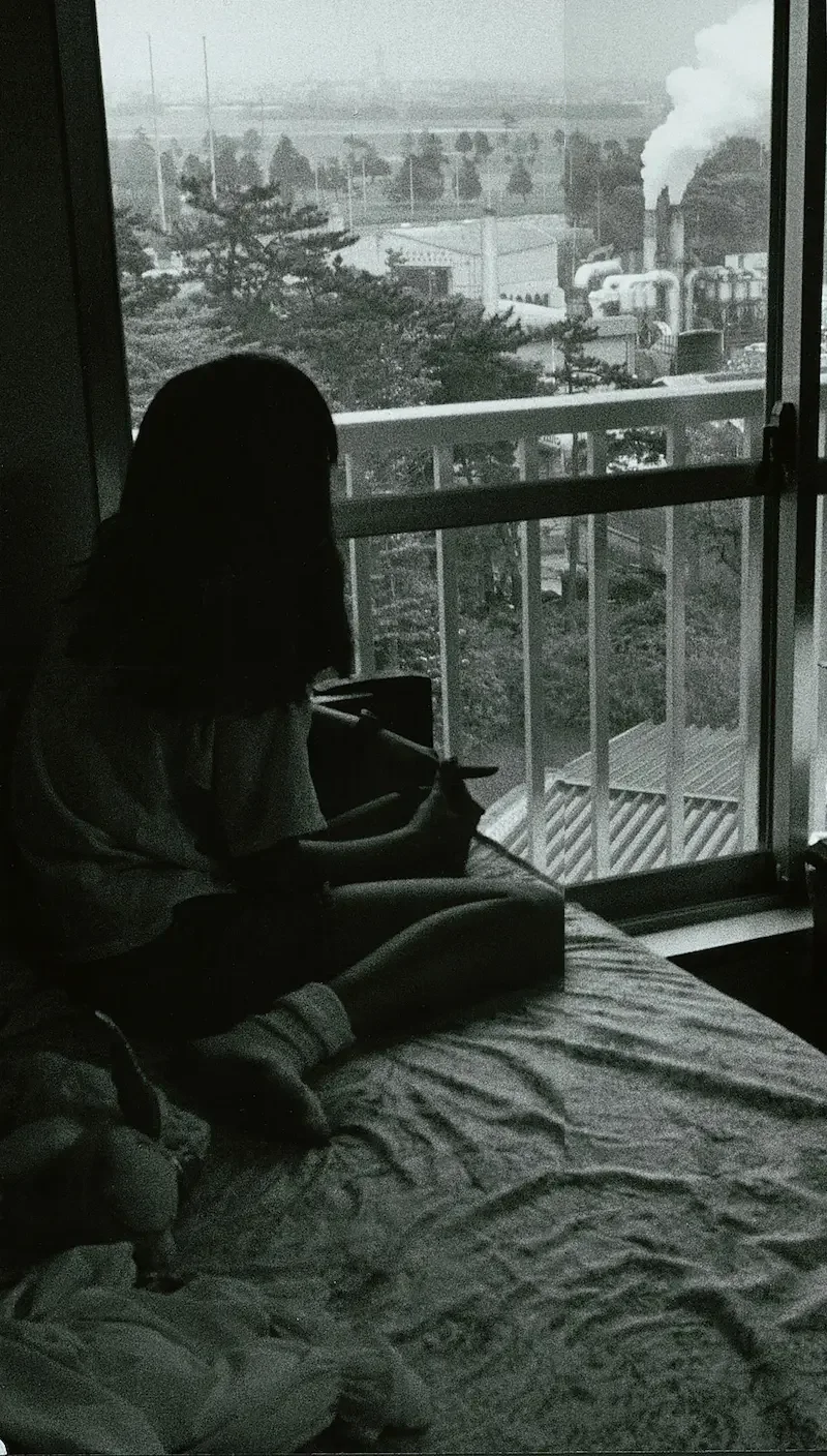 Girl looking outside towards incinerator