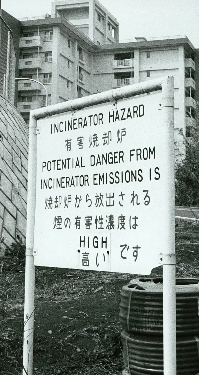 Warning sign for incinerator - potential danger from incinerator emissions