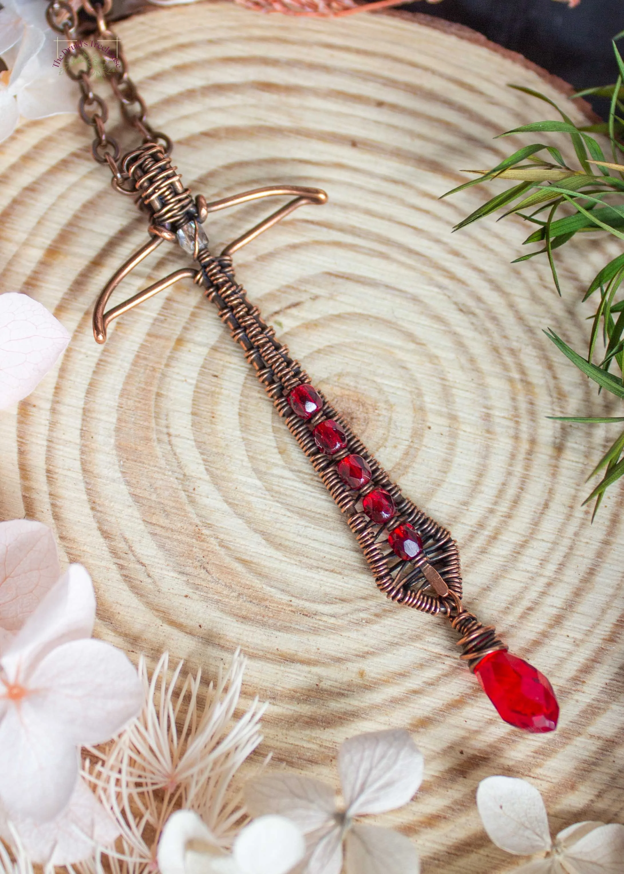 wire-wrapped-sword-pendant-with-red-beads-7239.jpg