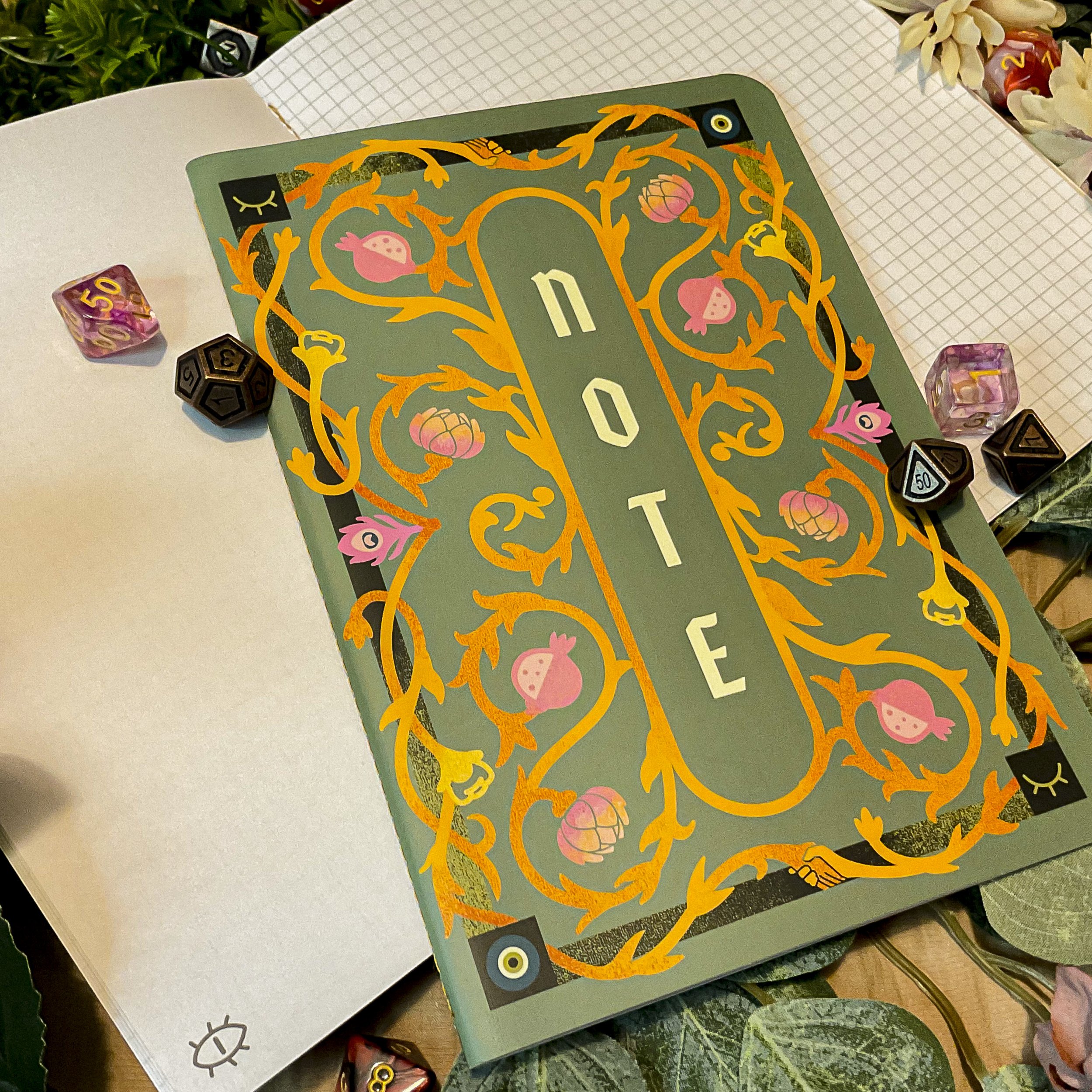 A5 Notebook designed for helping TTRPGs players keep track of notes and maps, with an interior that combines blank and grid pages