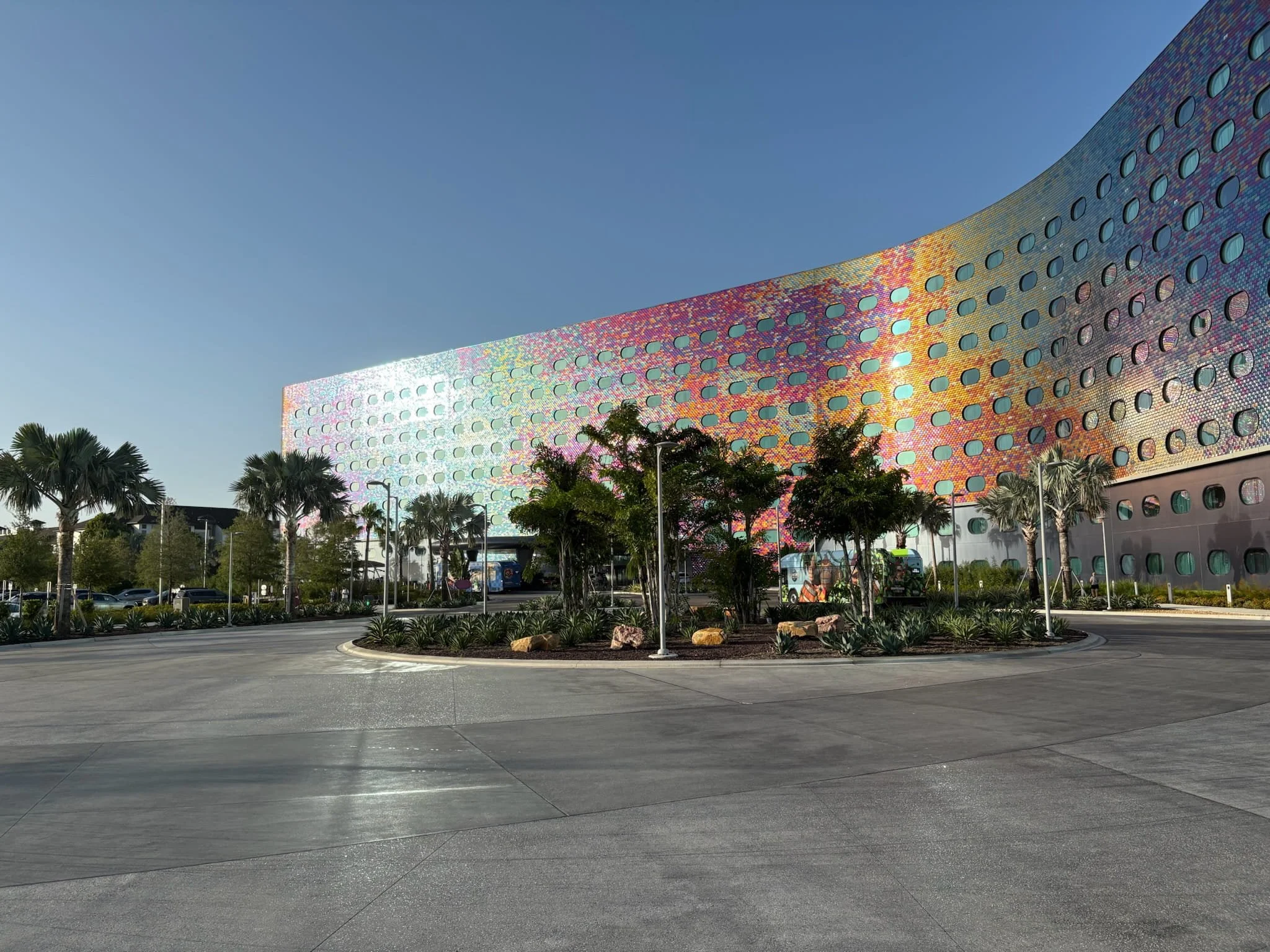 A picture of the glistening outside of Stella Nova hotel with the colourful tiles reflecting the sun and shining brightly in the early morning Florida days