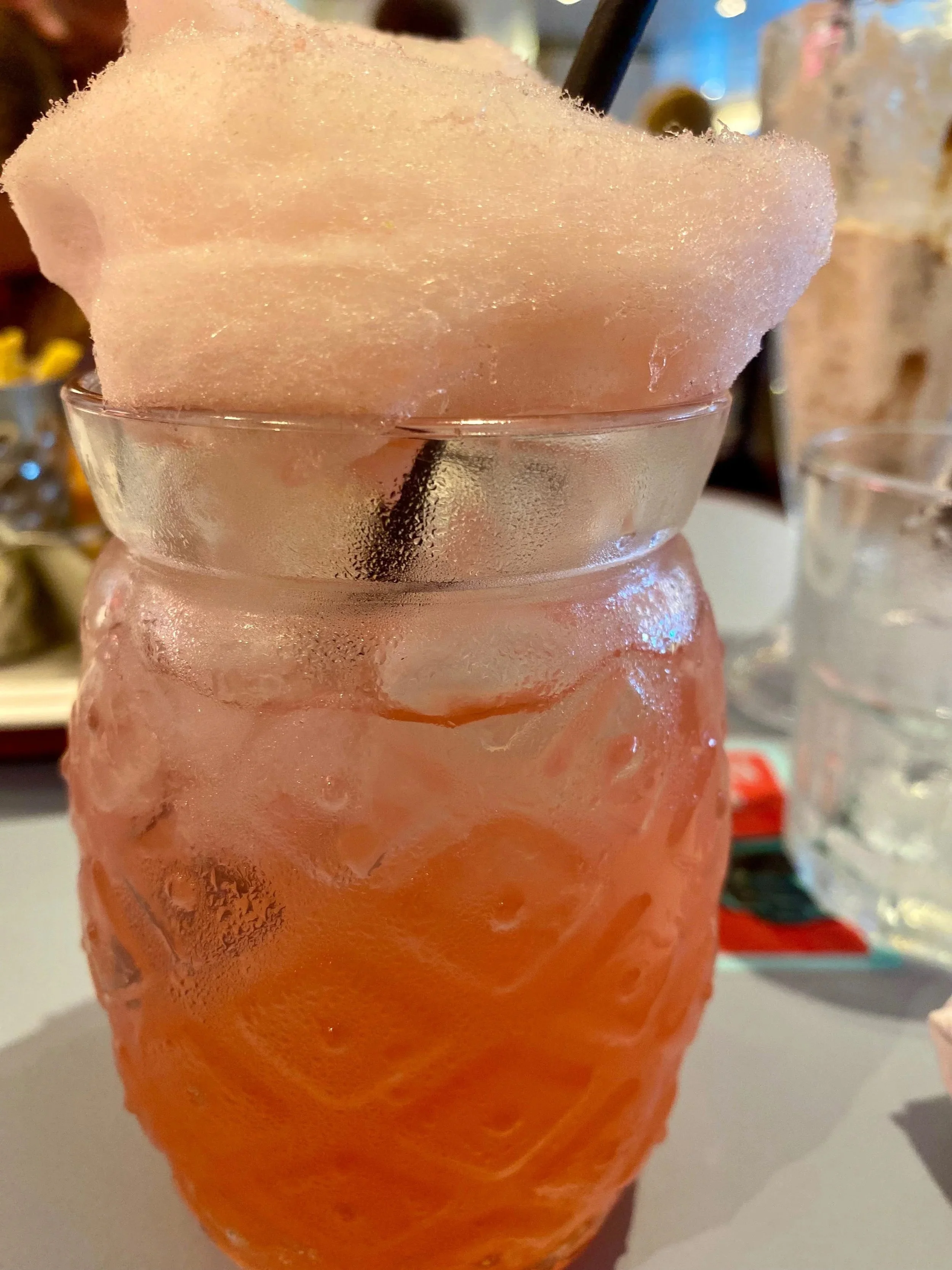 Picture of a kids mocktail with candy floss on top in 6th street diner, Ariva.