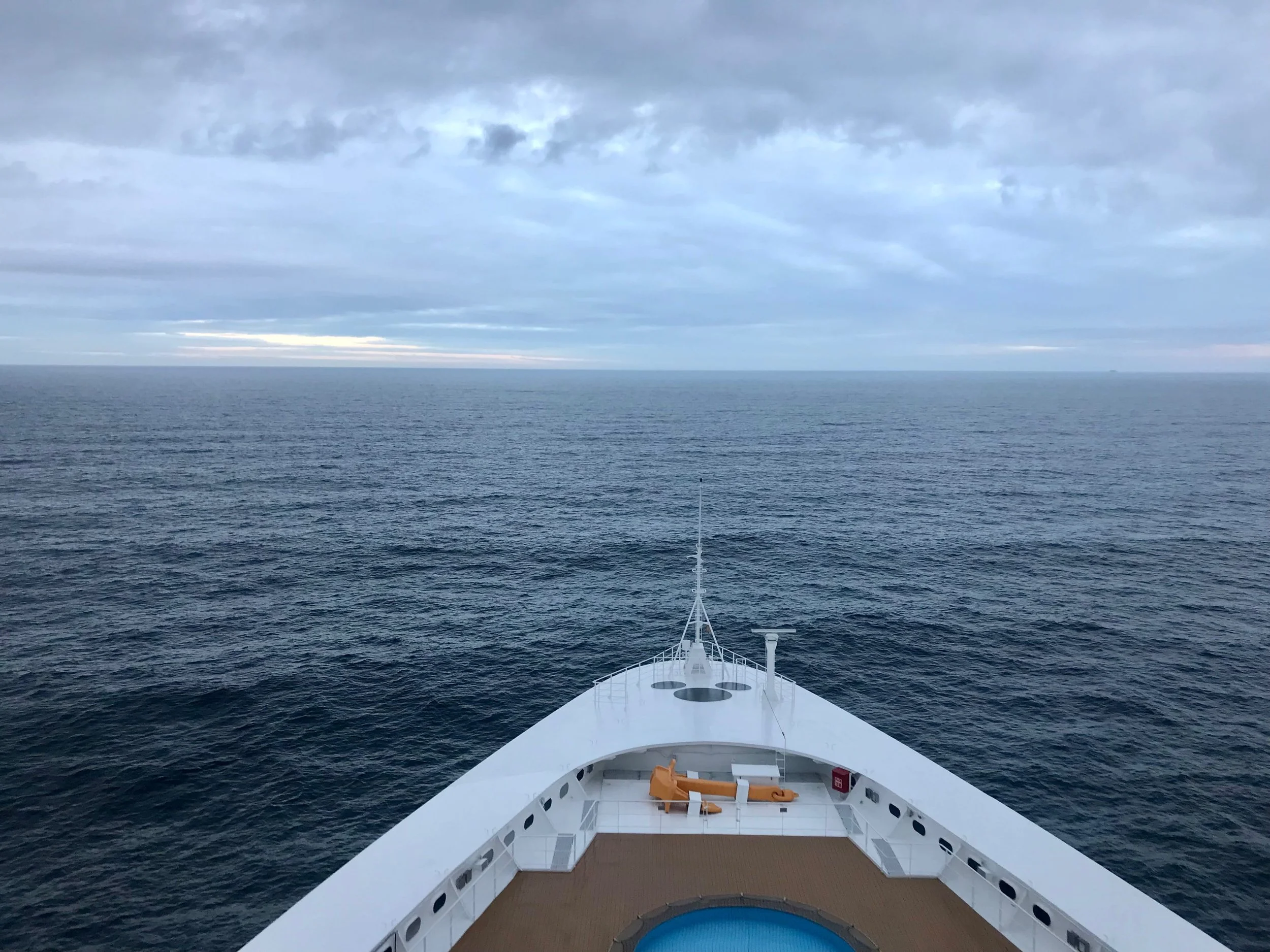 Shows the Bow of the Disney Magic sailing the ocean with a hidden Mickey for everyone to see.